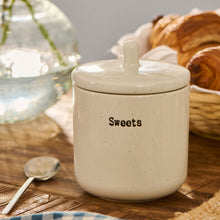Load image into Gallery viewer, White ceramic container jar wit h a lid labelled 'Sweets' on a wooden table with a blurred background

