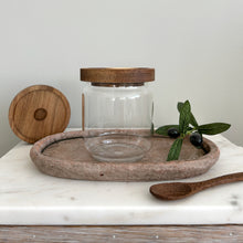 Load image into Gallery viewer, Minimalist small glass  jar with acacia lid,  styled with a wooden spoon and greenery in a modern kitchen setting.

