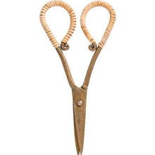 Load image into Gallery viewer, Brass scissors with hand-wrapped rattan handles resting on a rustic wooden surface — elegant artisan tool for desk, craft, or utility room decor.
